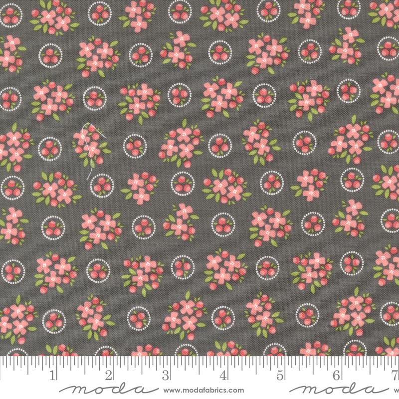 a gray background with pink flowers and circles