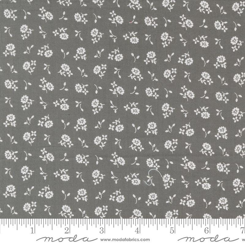 a gray fabric with white flowers on it