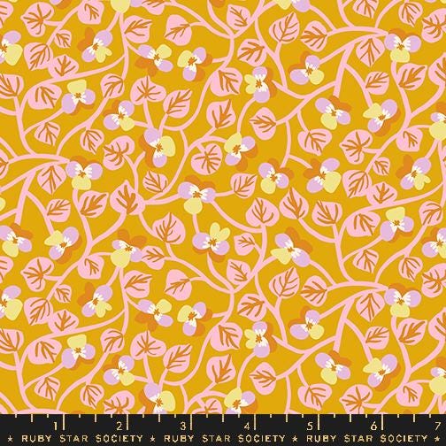 a yellow background with pink and yellow flowers