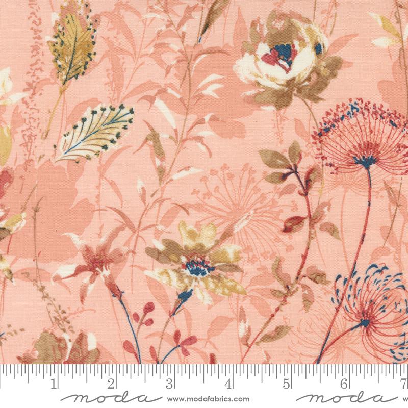 a pink floral print fabric with a ruler in front of it