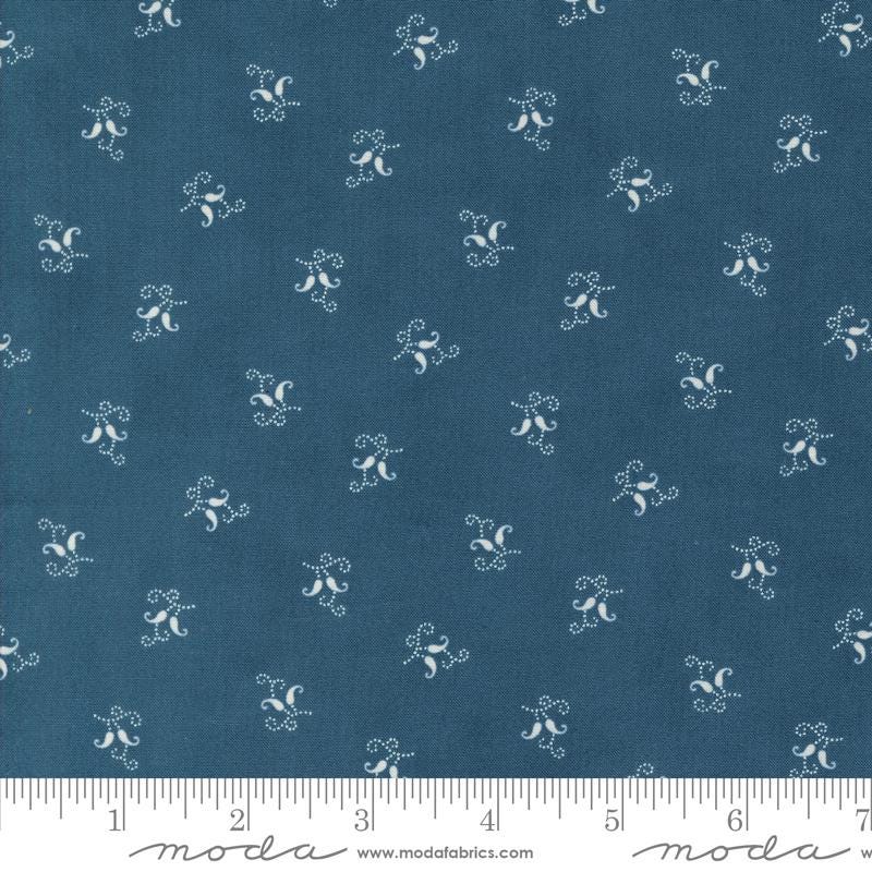a blue fabric with white flowers on it