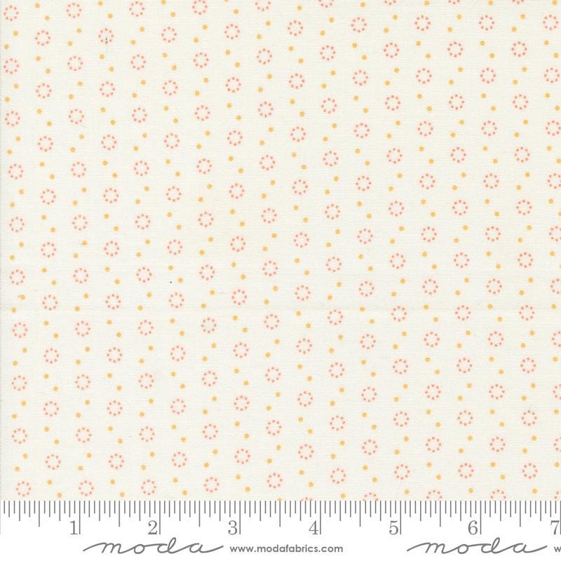 a ruler with a white background with orange dots