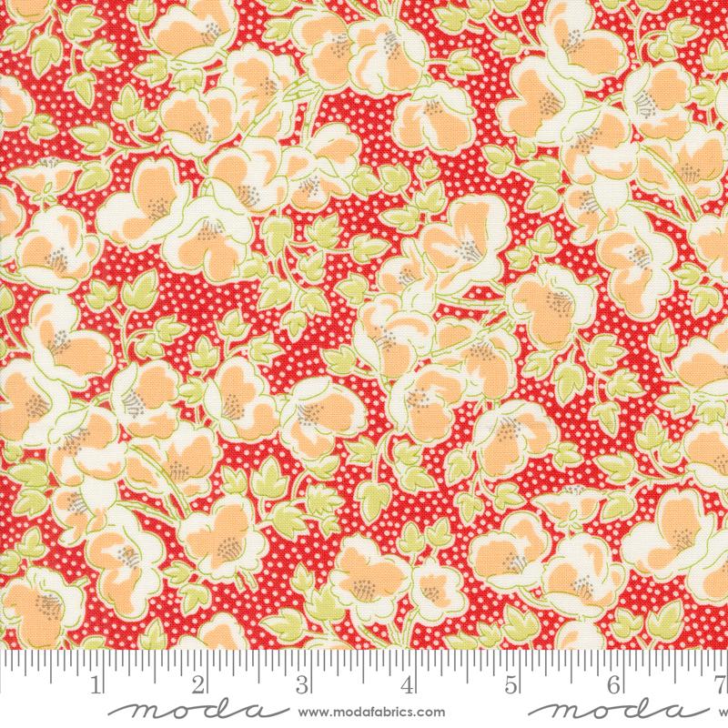 a red and yellow flowered fabric with polka dots