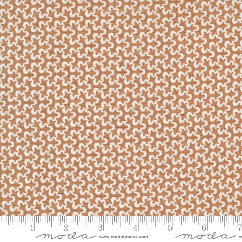 a ruler with a brown and white pattern on it