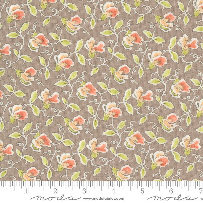 a brown background with pink flowers and green leaves