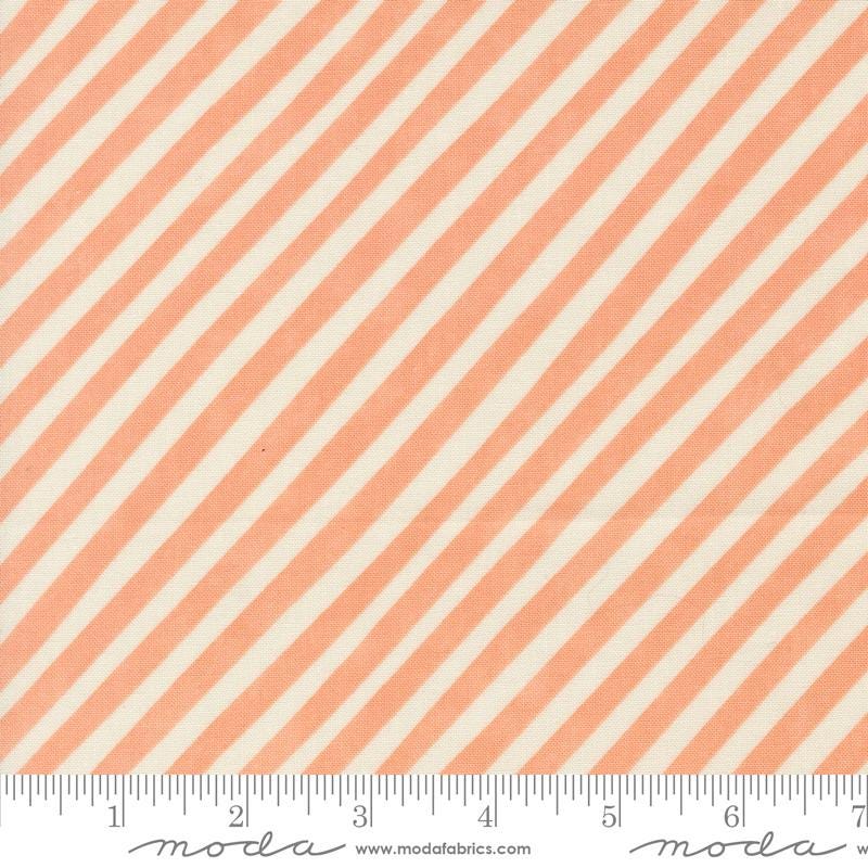 an orange and white striped fabric with a ruler