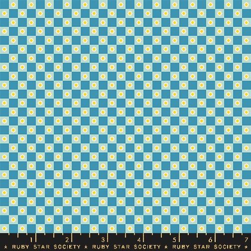 a blue and white checkered pattern with yellow dots