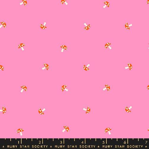 a pink background with red and white polka dots