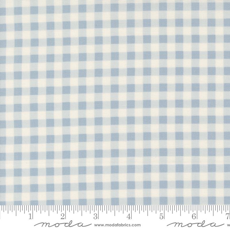 a blue and white checkered fabric with a ruler