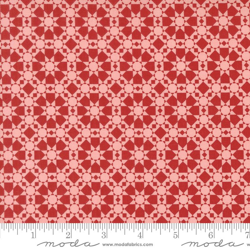 a ruler with a red and white pattern on it