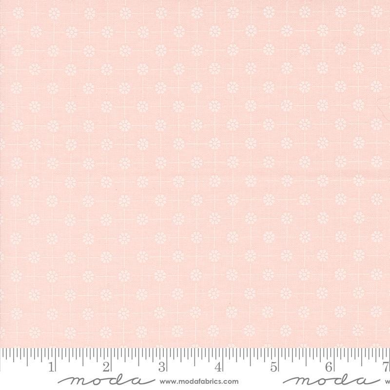 a pink background with white flowers and a ruler