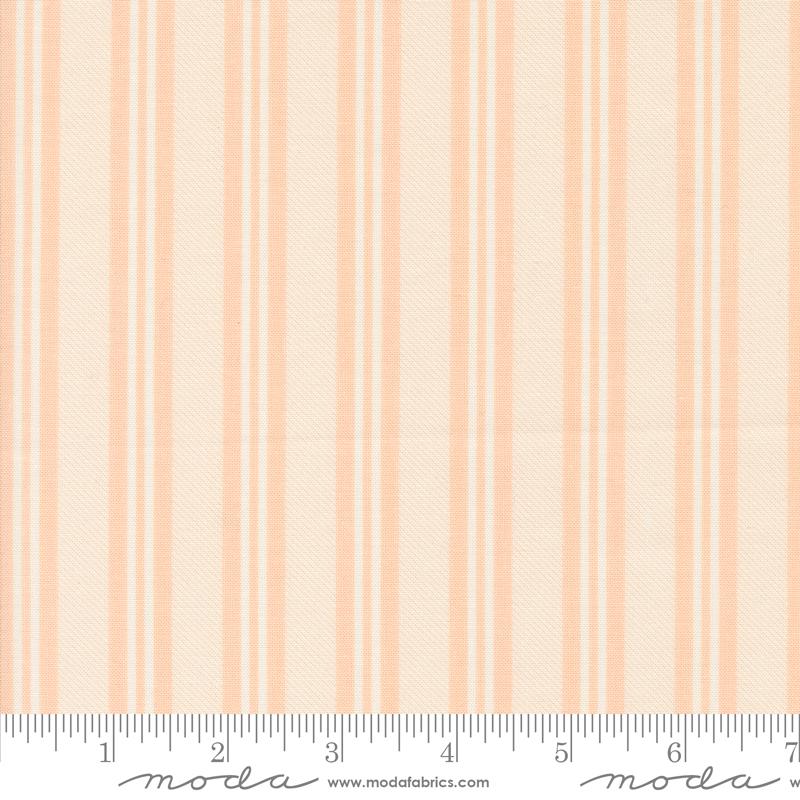 an orange and white striped fabric with a ruler