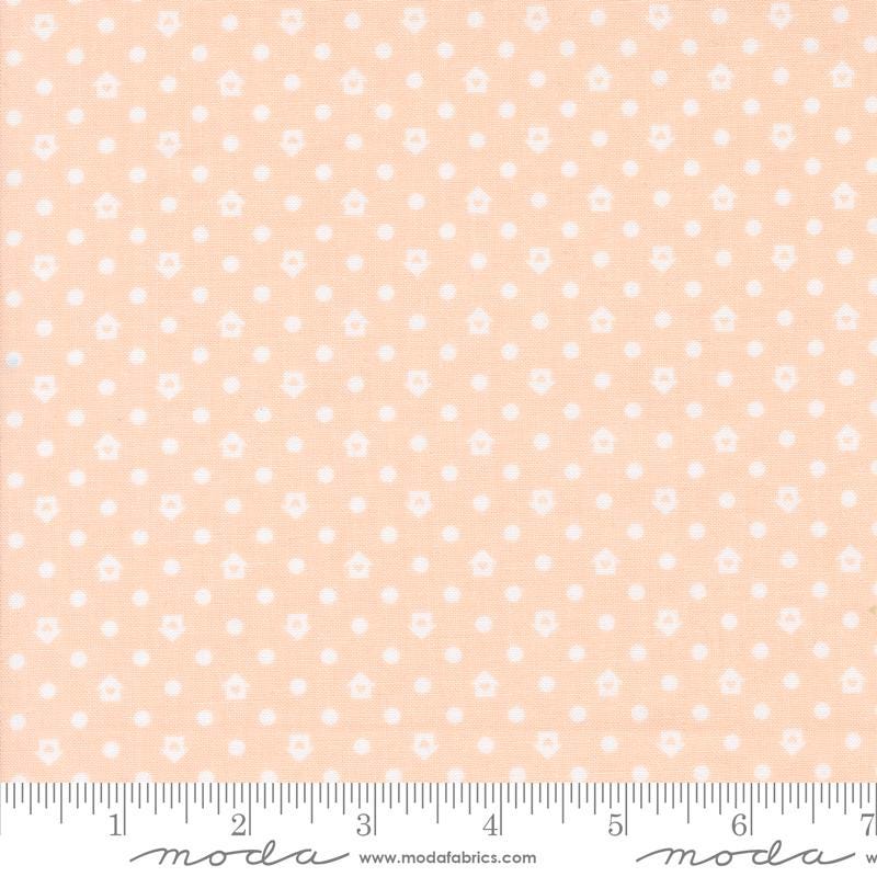 a ruler with a pink and white polka dot pattern on it