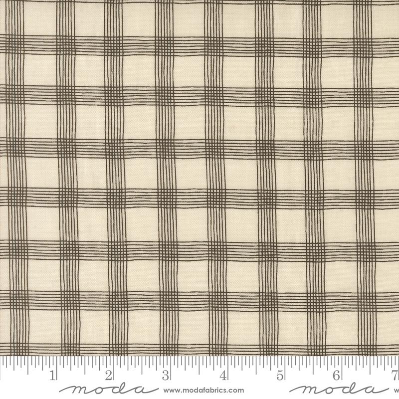 a white and black plaid fabric with a ruler