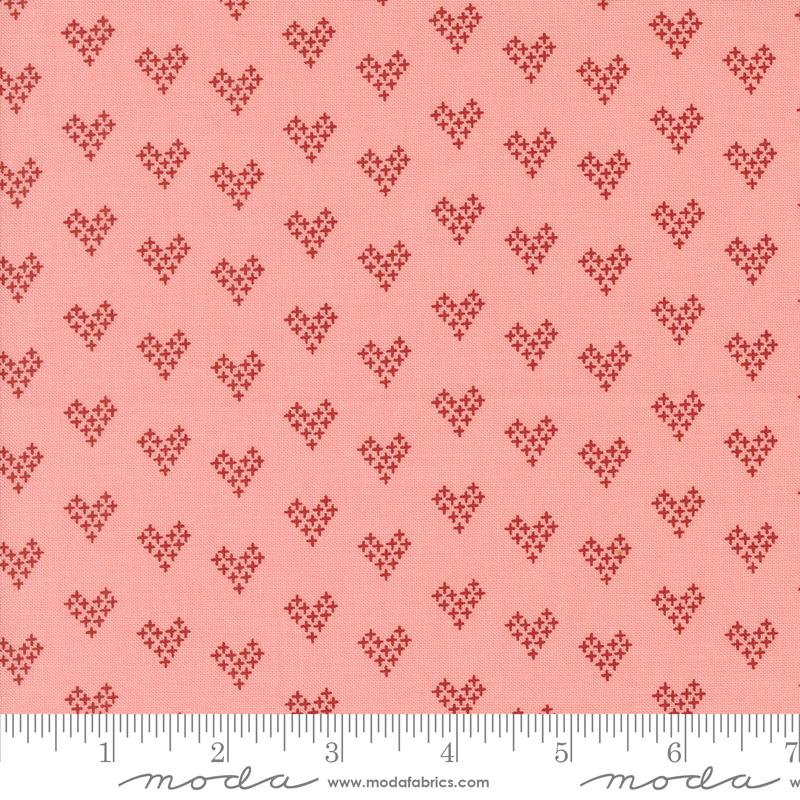 a pink background with small hearts on it