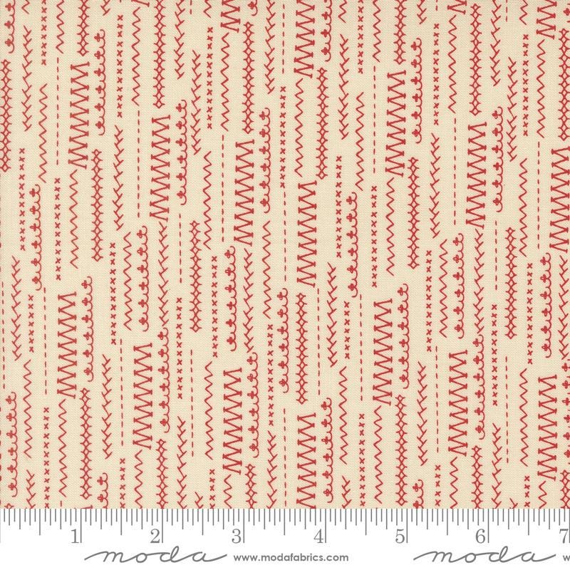 a ruler with a red and white pattern on it