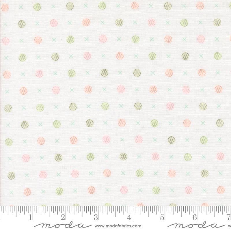 a white background with pink and green polka dots