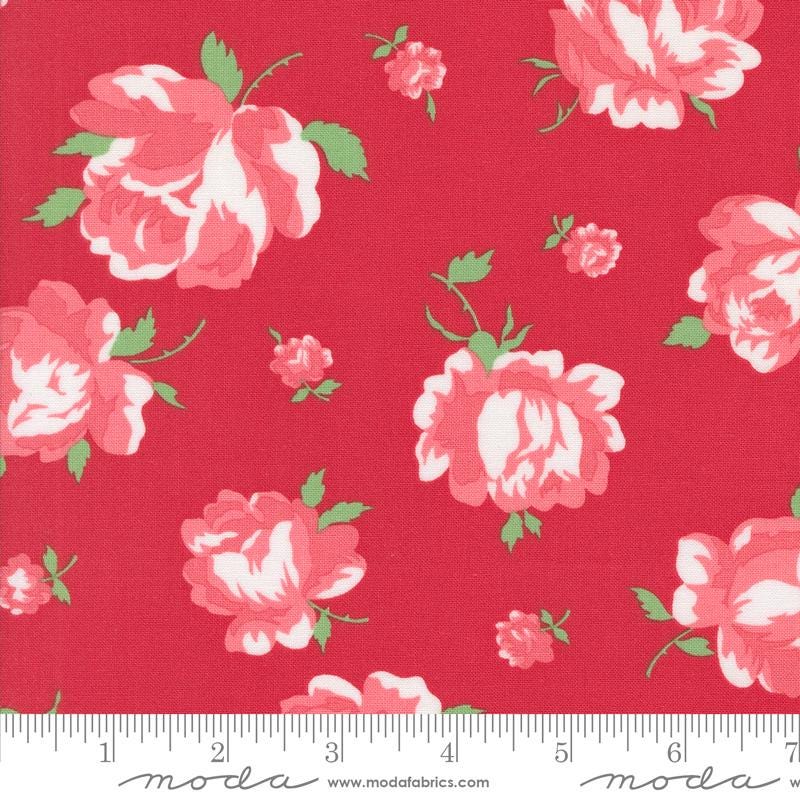 a red flowered fabric with white and pink flowers