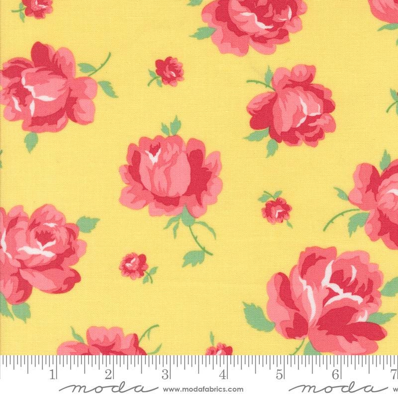 a yellow background with pink roses on it
