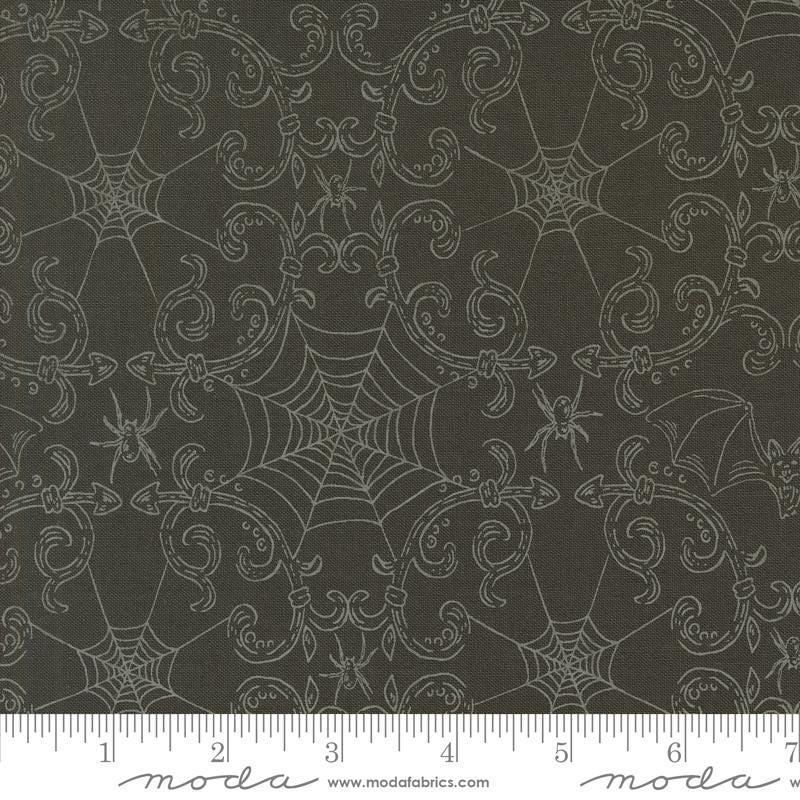 a black background with white spider webs on it