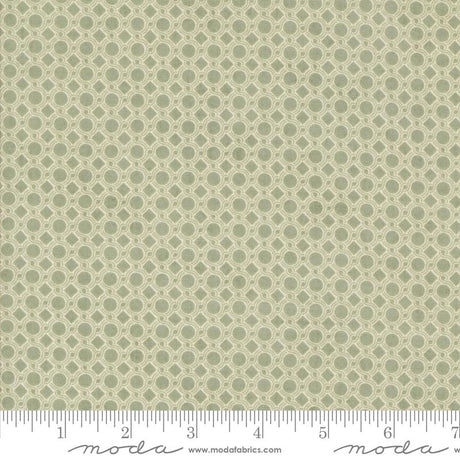 a repeating pattern of green circles on a fabric surface.