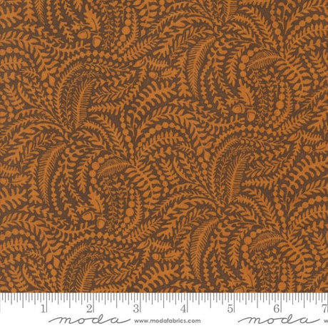 The image is a close-up of a fabric with a repeating pattern of brown leaves and acorns. The pattern is intricate and detailed, creating a visually appealing design.