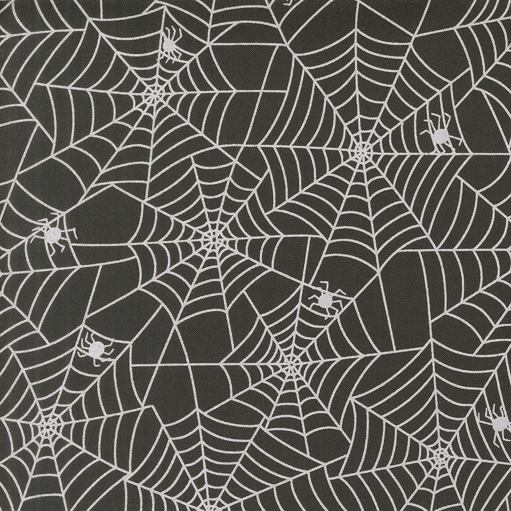 a repeating pattern of white spider web designs on a dark background.