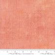 The image is a close-up of a textured fabric with a gradient of peach and orange colors.