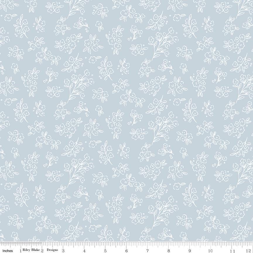 a repeating pattern of white flowers and leaves on a light blue background.