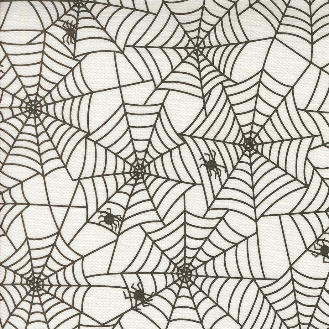 a repeating pattern of black and white spider web designs.