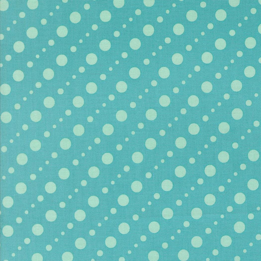 a pattern of white polka dots on a light blue background.
