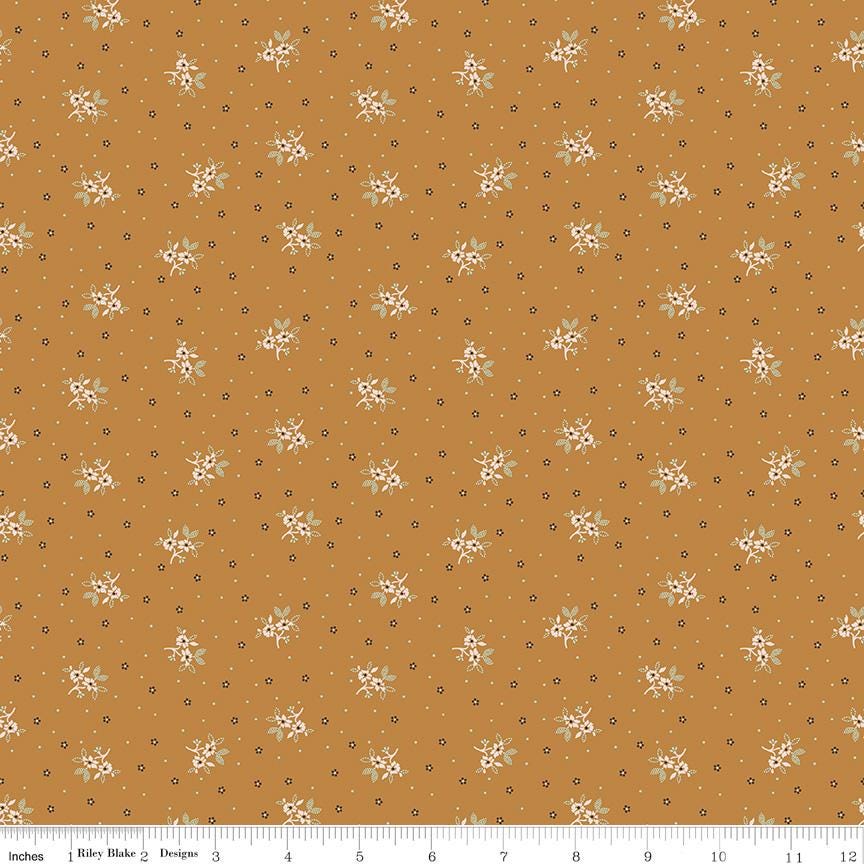 a repeating pattern of small white flowers against a brown background, creating a visually appealing and harmonious design.