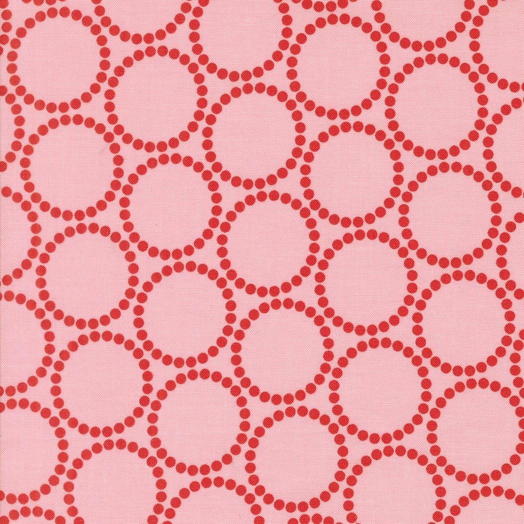 a repeating pattern of pink circles on a pink background.