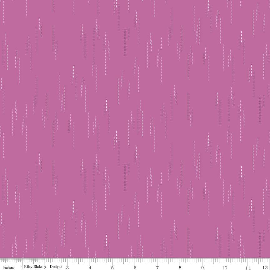 The image is a pink background with white dots or lines scattered across it, creating a visually interesting and abstract pattern.