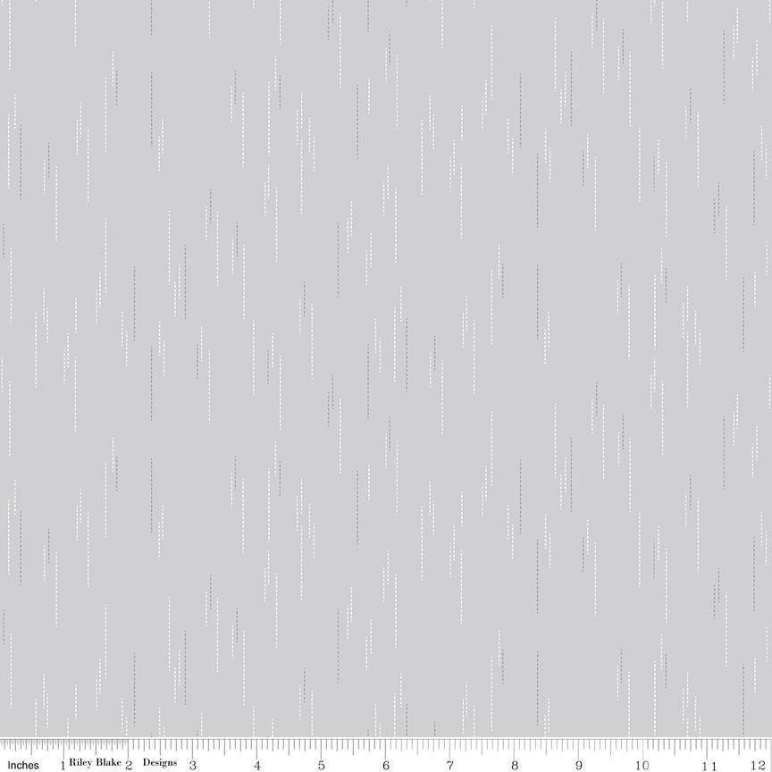 The image is a gray background with white dots or lines scattered across it, creating a repeating pattern.
