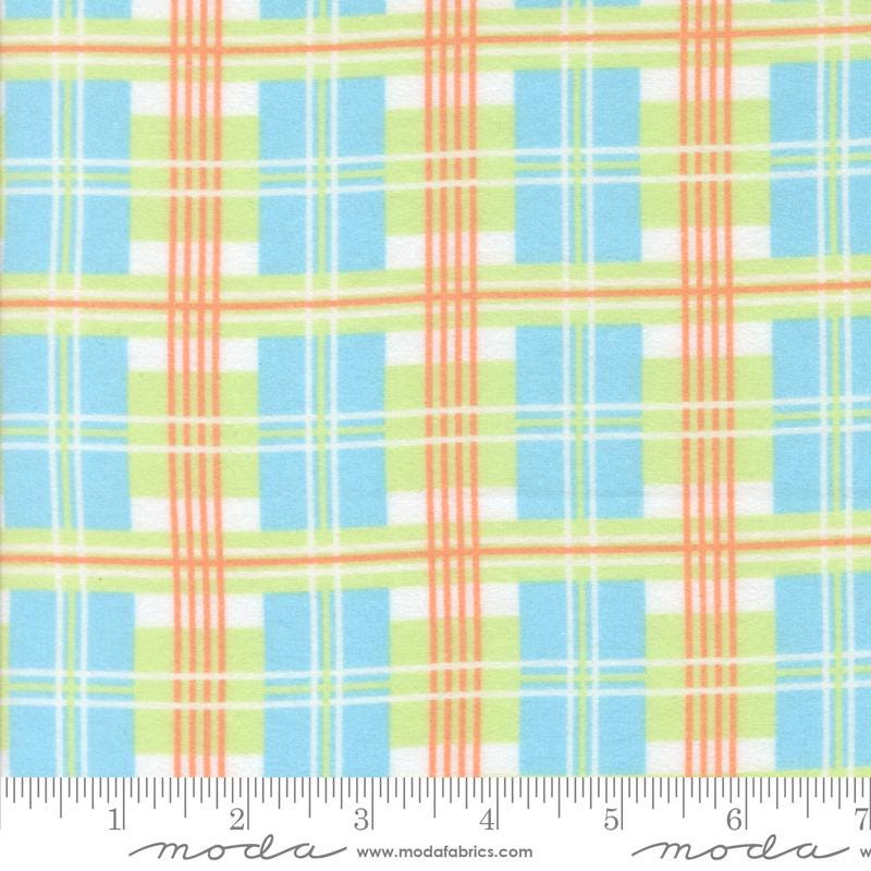 The image is a fabric with a plaid pattern in shades of blue, green, and orange. The fabric appears to be a soft, textured material suitable for clothing or home decor.