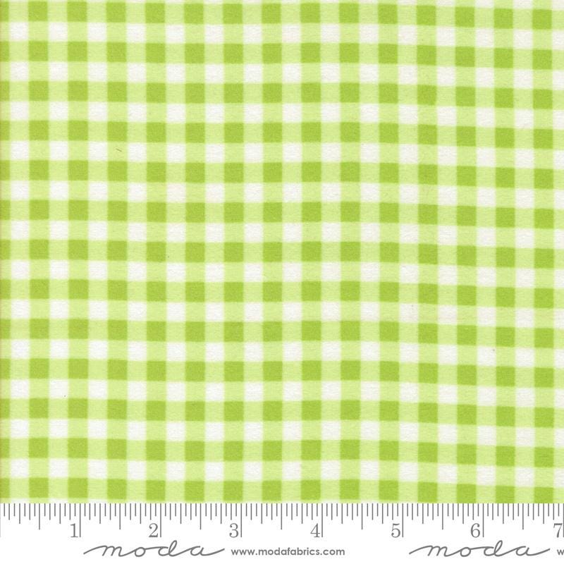 The image is a close-up of a fabric with a green and white checkered pattern.
