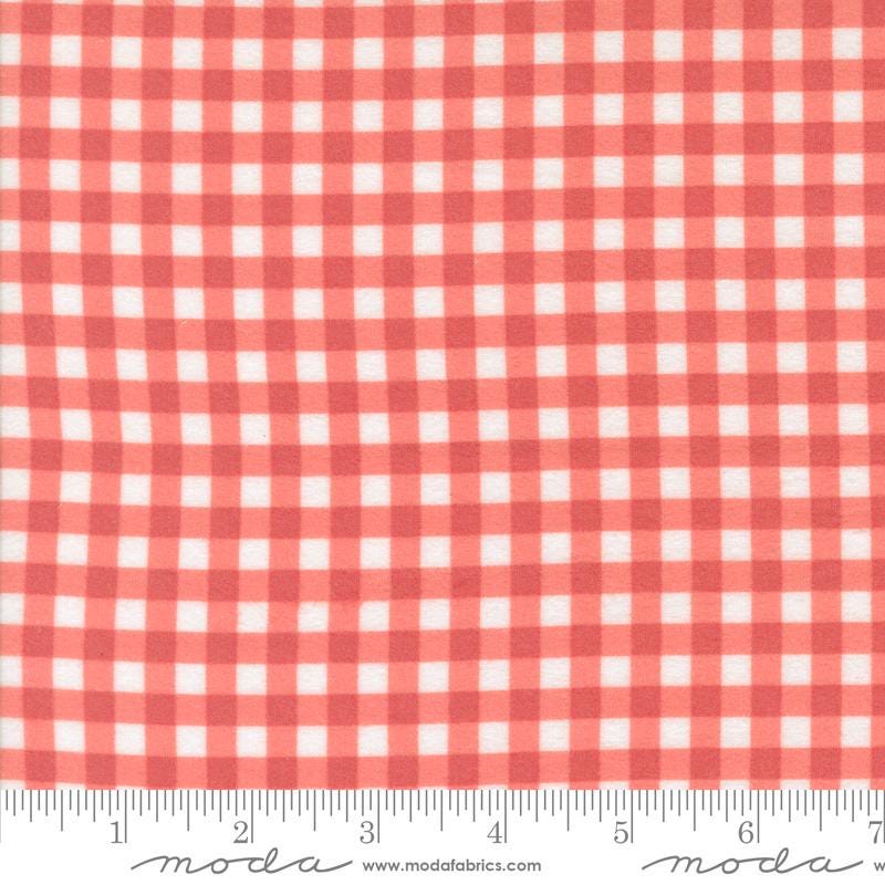 The image is a close-up of a fabric with a red and white checkered pattern.