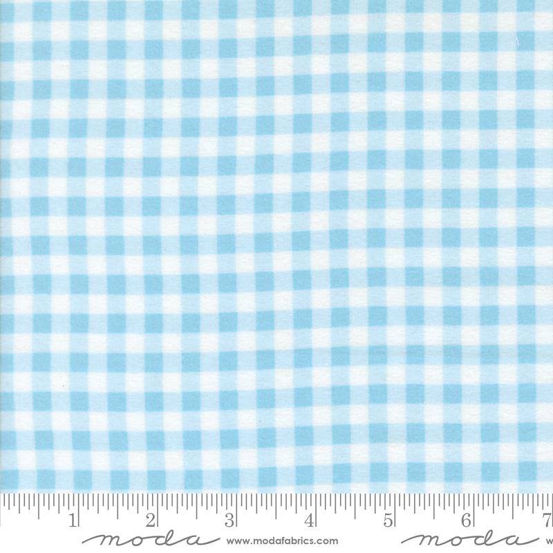The image is a close-up of a fabric with a blue and white checkered pattern.