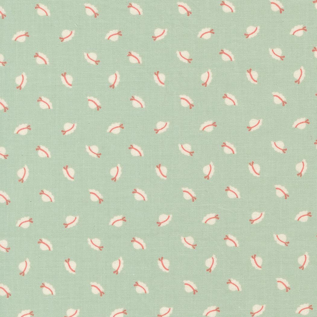 a repeating pattern of small white and red hats on a light green background.