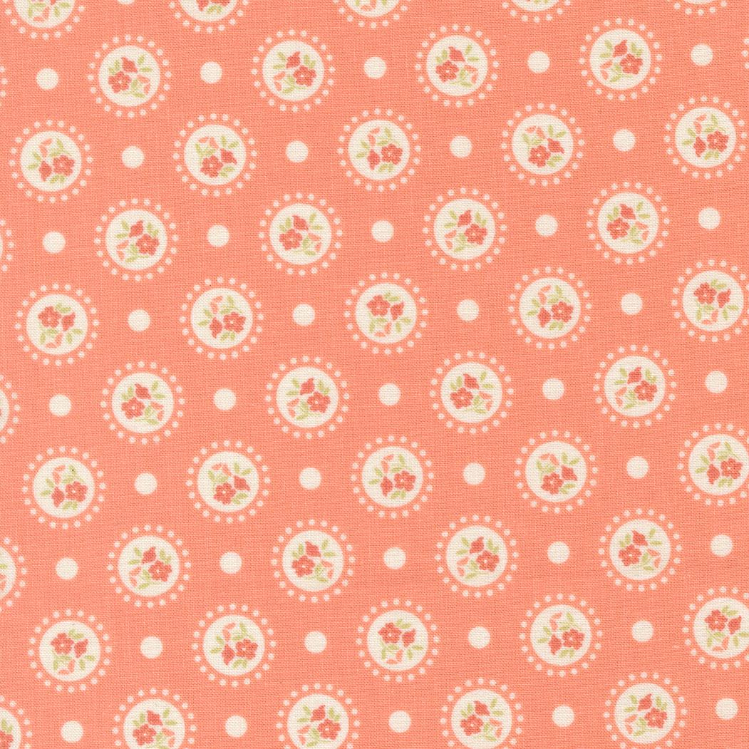 a repeating pattern of white circles with floral designs on a coral-colored background.