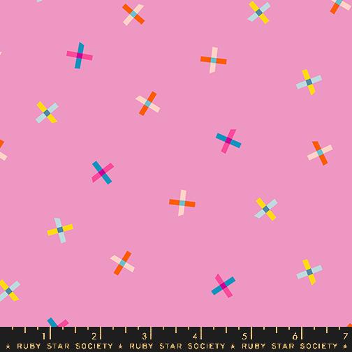 a pattern of colorful crosses on a pink background.