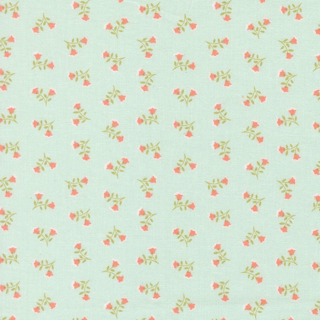 a repeating pattern of small pink flowers on a light green background.