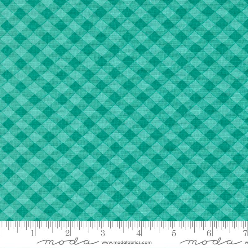 a close-up view of a fabric with a green and white checkered pattern. The fabric appears to be made of a material with a diamond-like pattern, creating a visually striking and textured appearance.