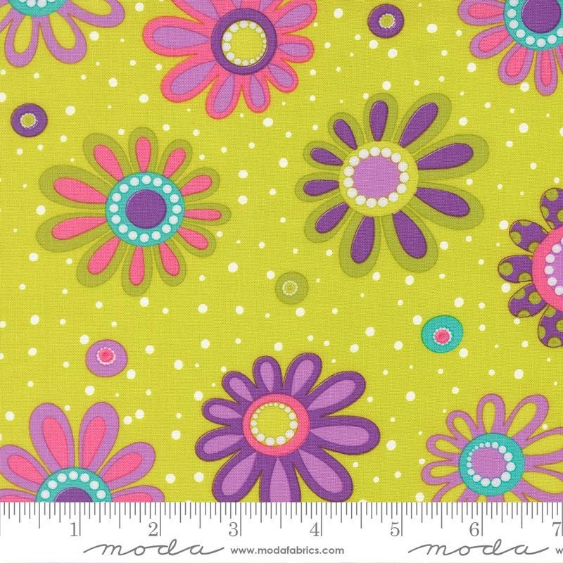 a vibrant and colorful fabric with a repeating pattern of stylized flowers in shades of pink, purple, and green against a yellow background with white polka dots.