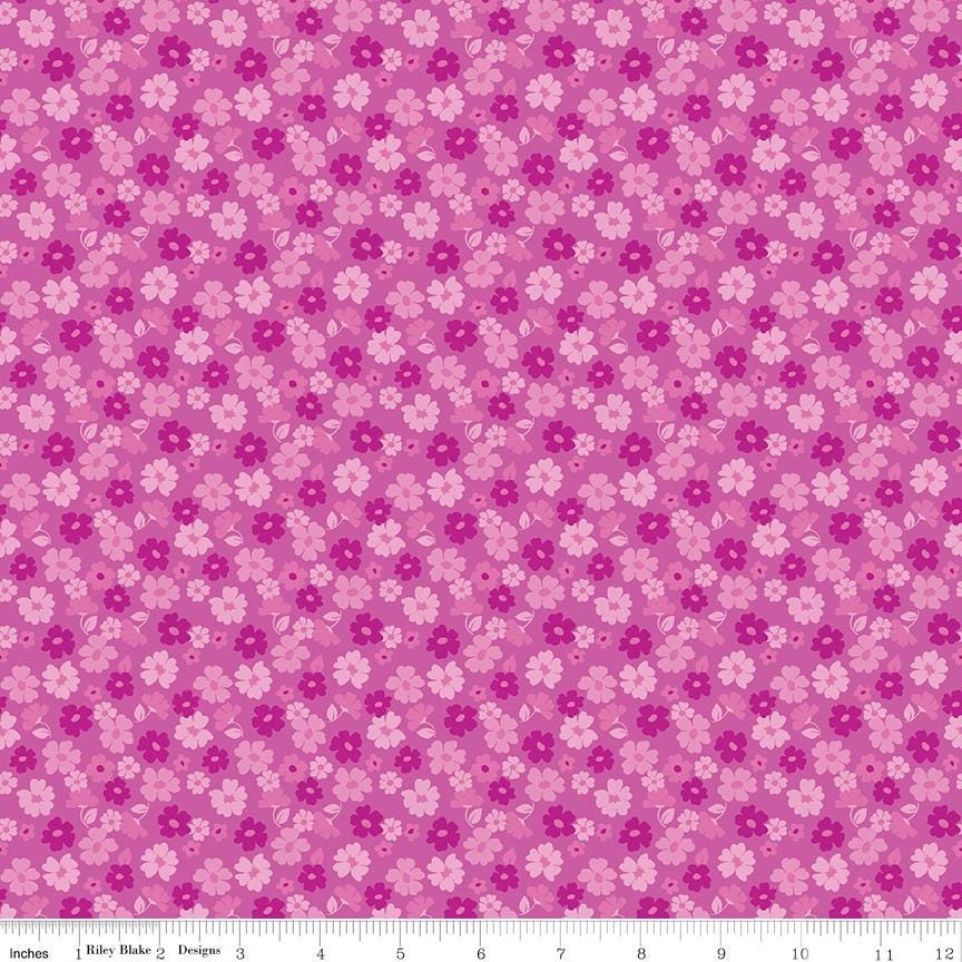 a repeating pattern of pink and white flowers on a pink background.