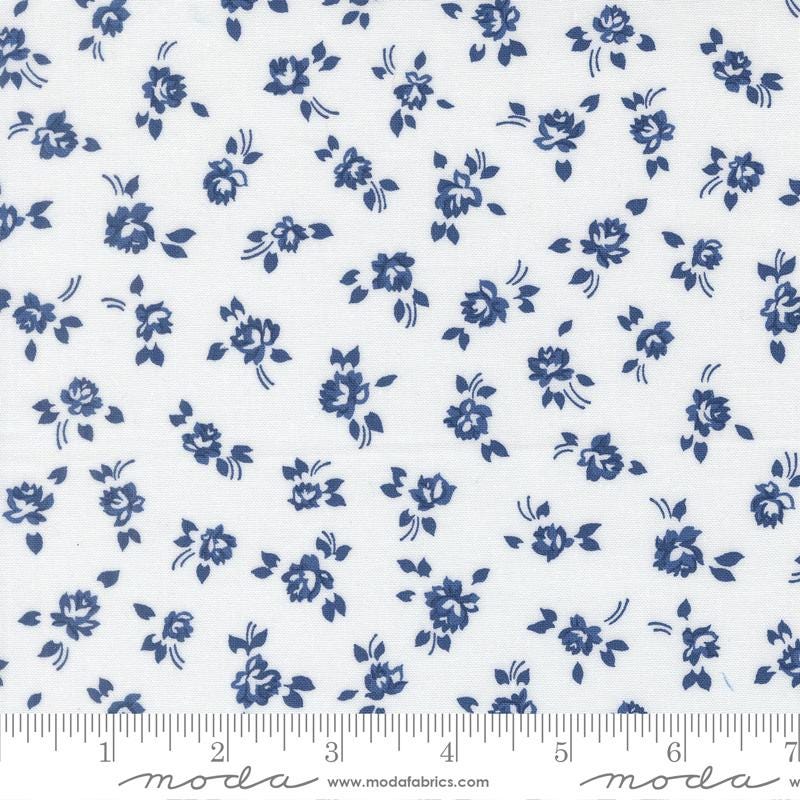 a repeating pattern of blue flowers on a white background.