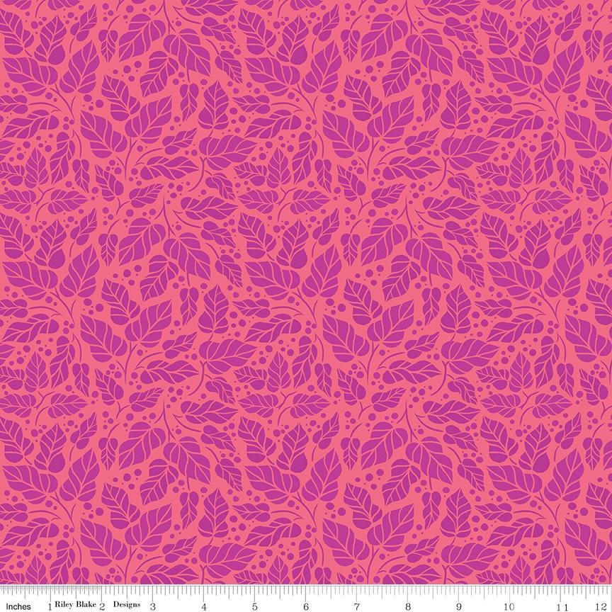 a repeating pattern of pink and orange leaves on a fabric surface.