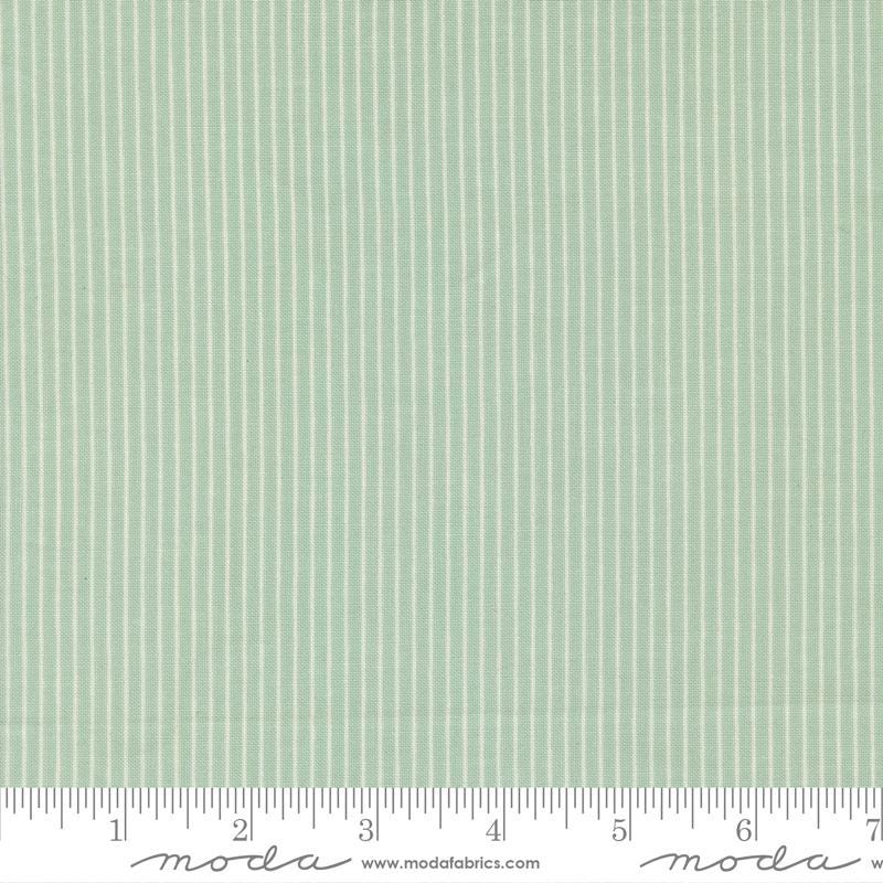 The image is a close-up of a fabric with a striped pattern in a light green color.