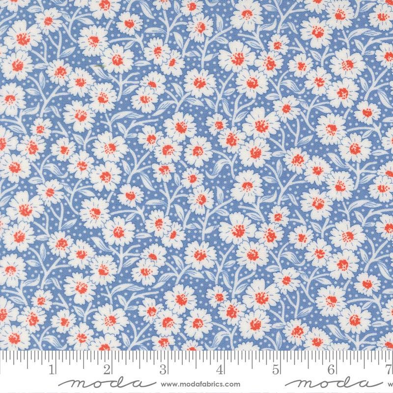 a repeating pattern of white and red flowers on a blue background.